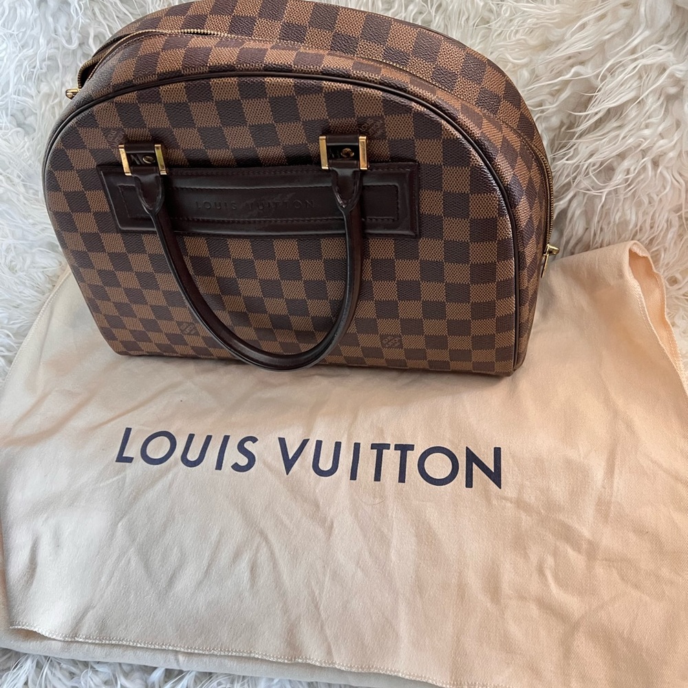 Louis Vuitton Nolita 100%  Authentic in Great Excellent condition.